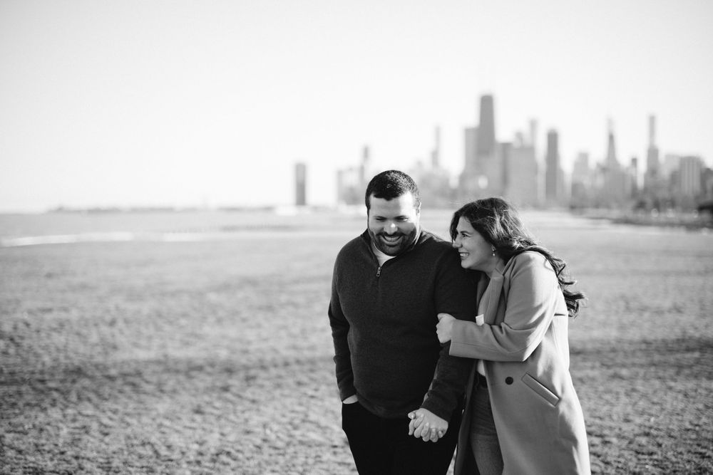 Playful moment captured as couple explores the loop in downtown Chicago