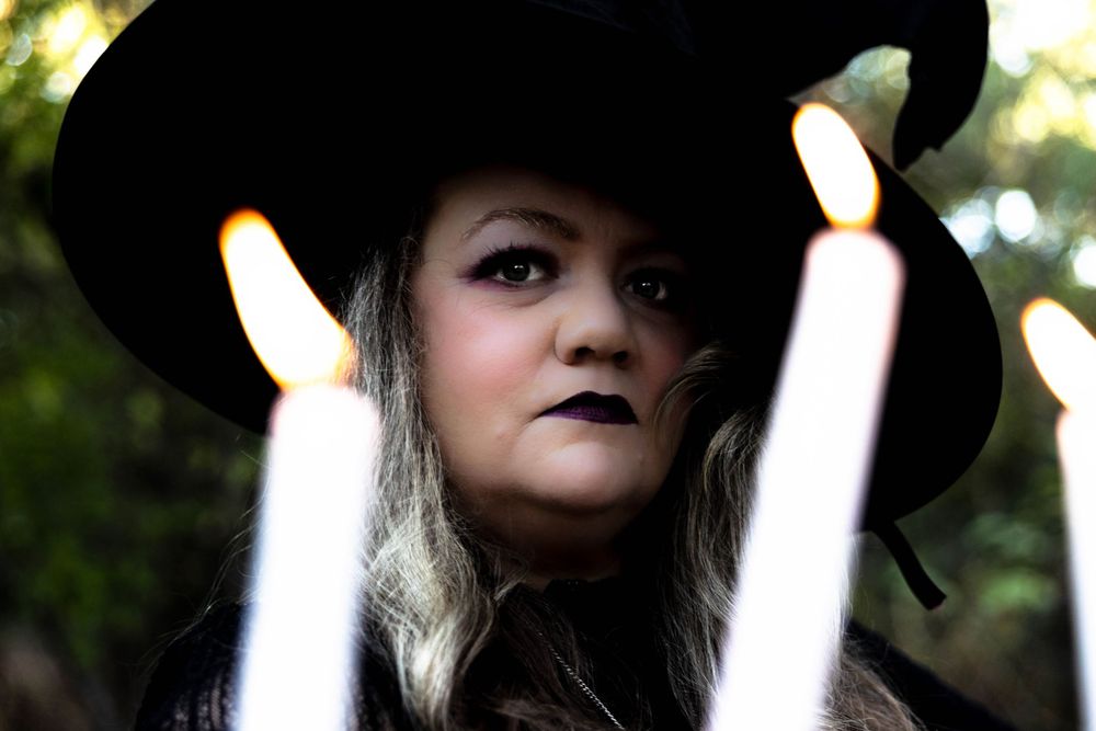 A beautiful witch in the woods.