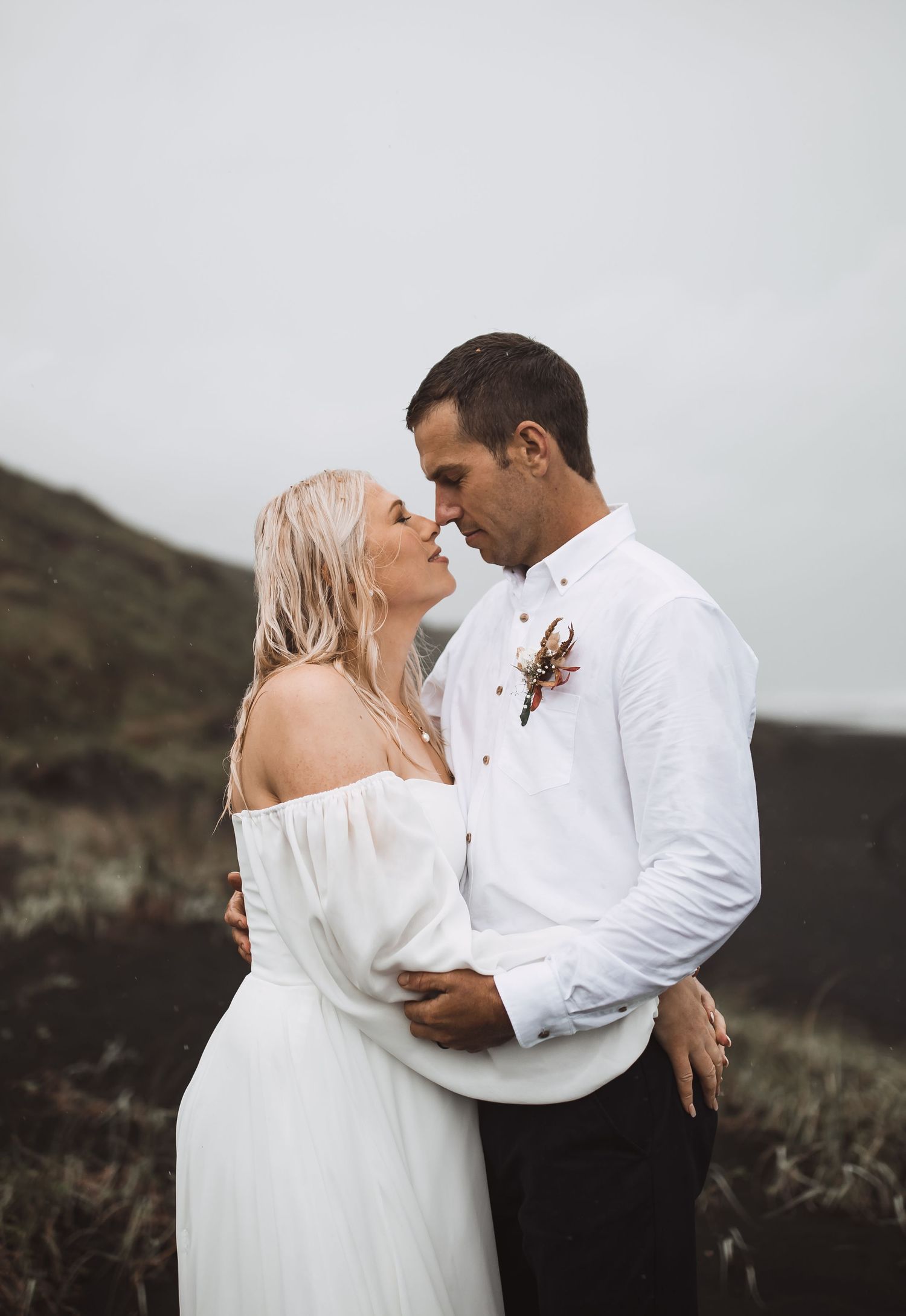 A romantic wedding photo series showing intimate moments between newlyweds against a moody outdoor backdrop.