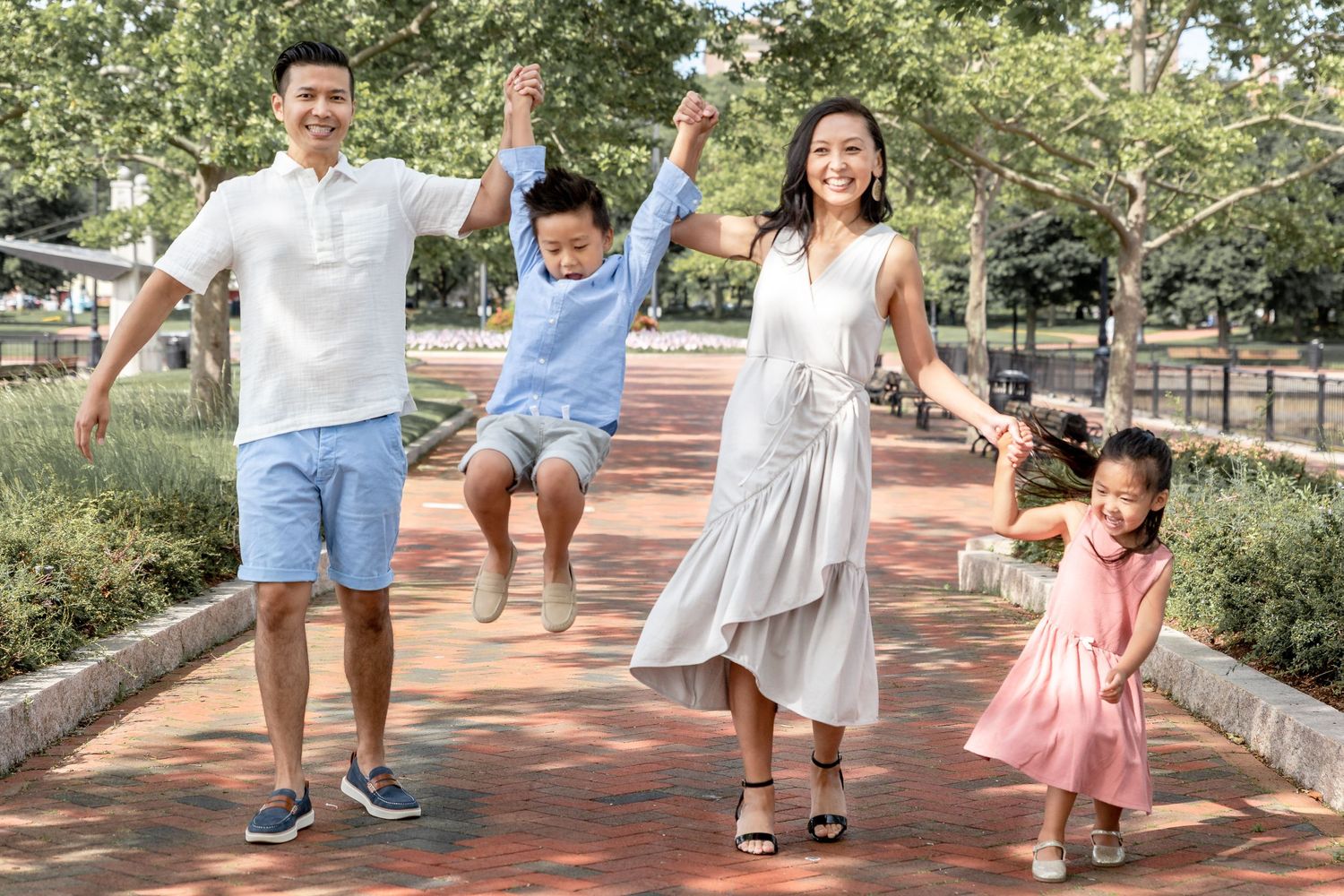 Best Family Photographer In Boston Park parents lifting two kids