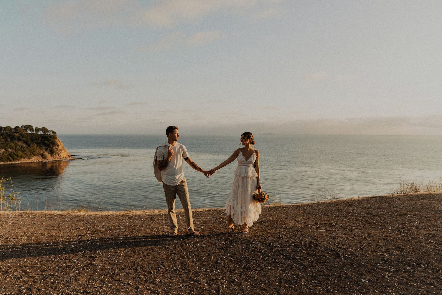 Bride and groom couple's portraits after a Palos Verdes cliffs wedding overlooking the ocean