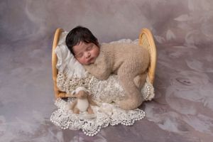 newborn baby in beige setup professional photography near Walsall
