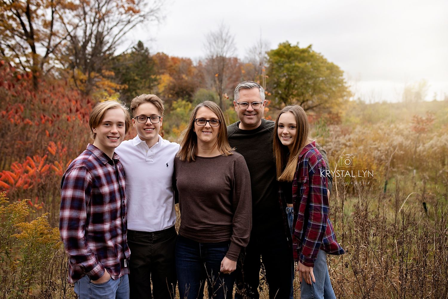 Family photo with teenagers in the golden light