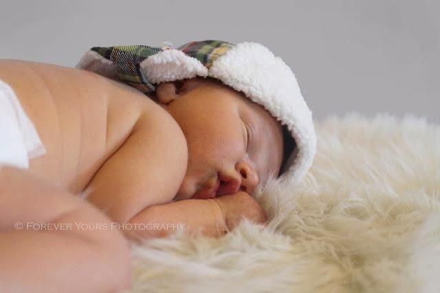 Baby Boy in Hat on Rug - Newborn Photo Session - At Home