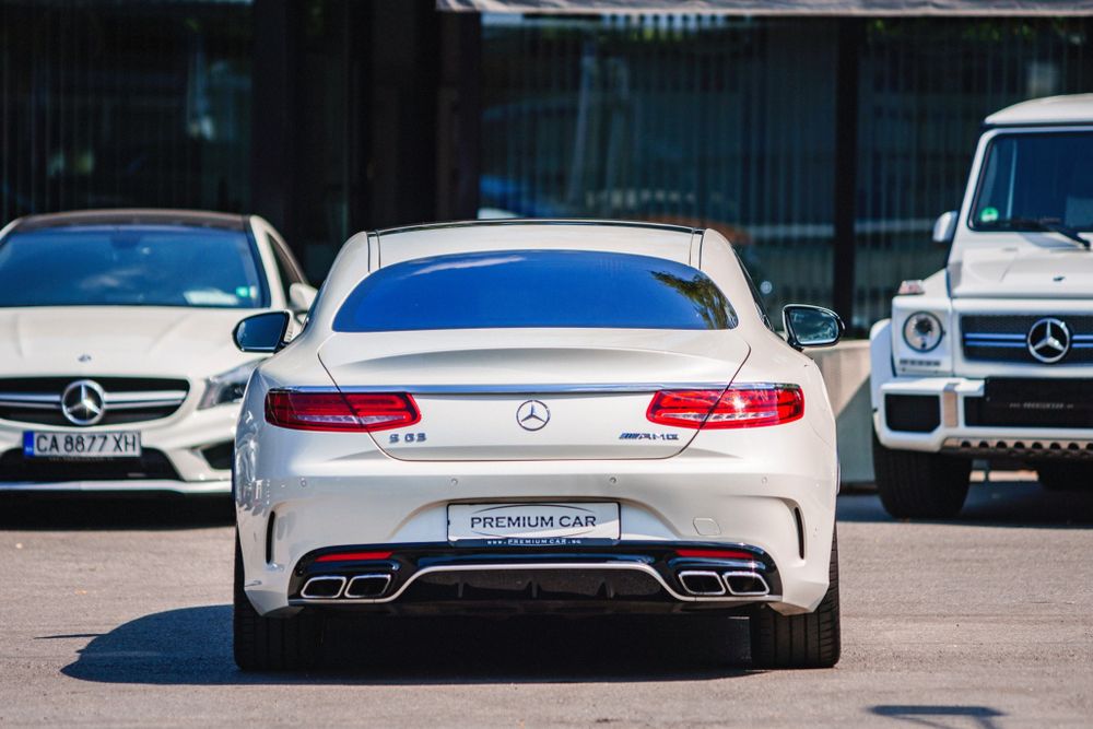 Rear view of a white Mercedes-Benz S-Class coupe showing distinctive LED taillights.