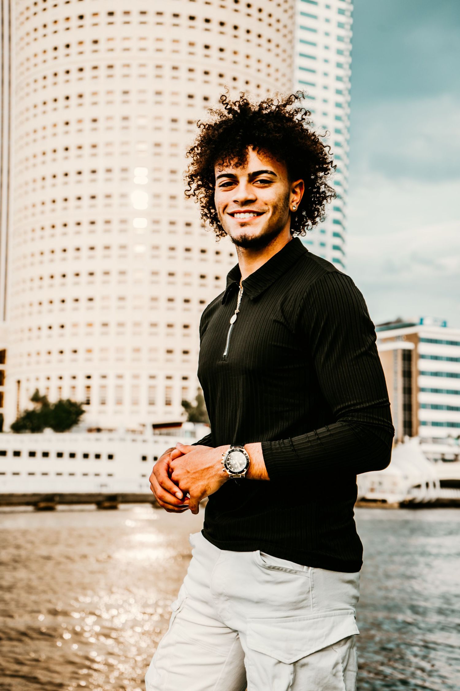 Outdoor Senior Portrait Session at University of Tampa in Tampa, FL; Senior pictures, teen posing with city backdrop