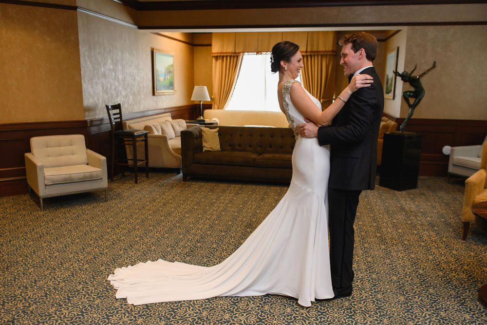 Bride and groom embrace before wedding at InterContinental Cleveland photographed by Tom Forrest.