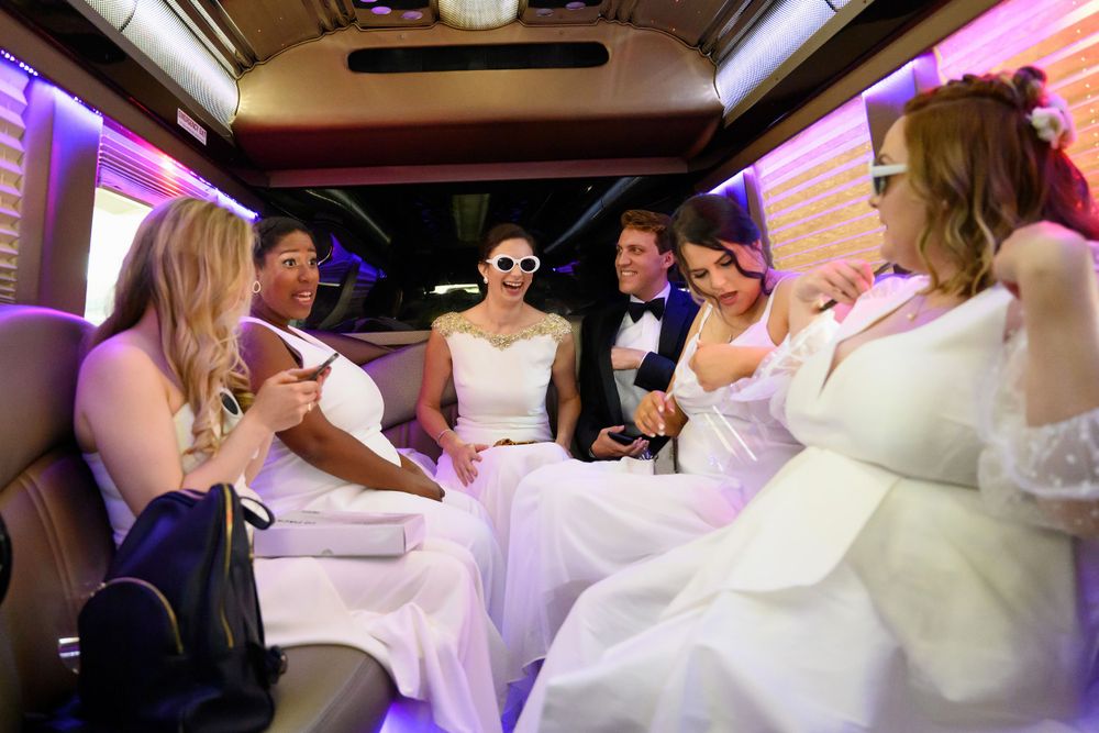 Bridal party in shuttle bus on wedding day in Cleveland, Ohio.