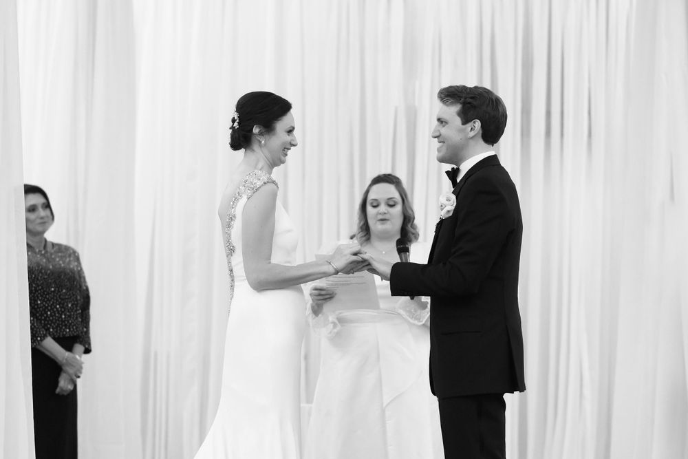 Couple exchanging vows during wedding ceremony at InterContinental Cleveland photographed by Tom Forrest.