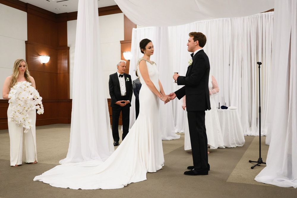 Couple during wedding ceremony at InterContinental Cleveland photographed by Tom Forrest.