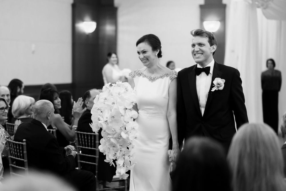 Newlyweds during wedding ceremony at InterContinental Cleveland photographed by Tom Forrest.
