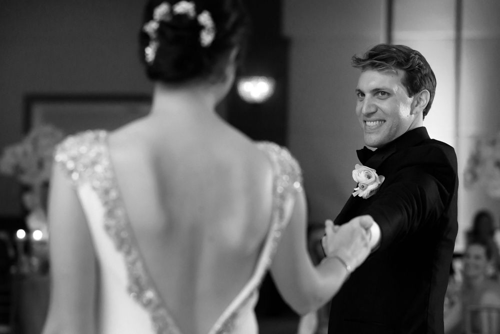 Groom dances with bride during wedding reception at InterContinental Cleveland photographed by Tom Forrest.