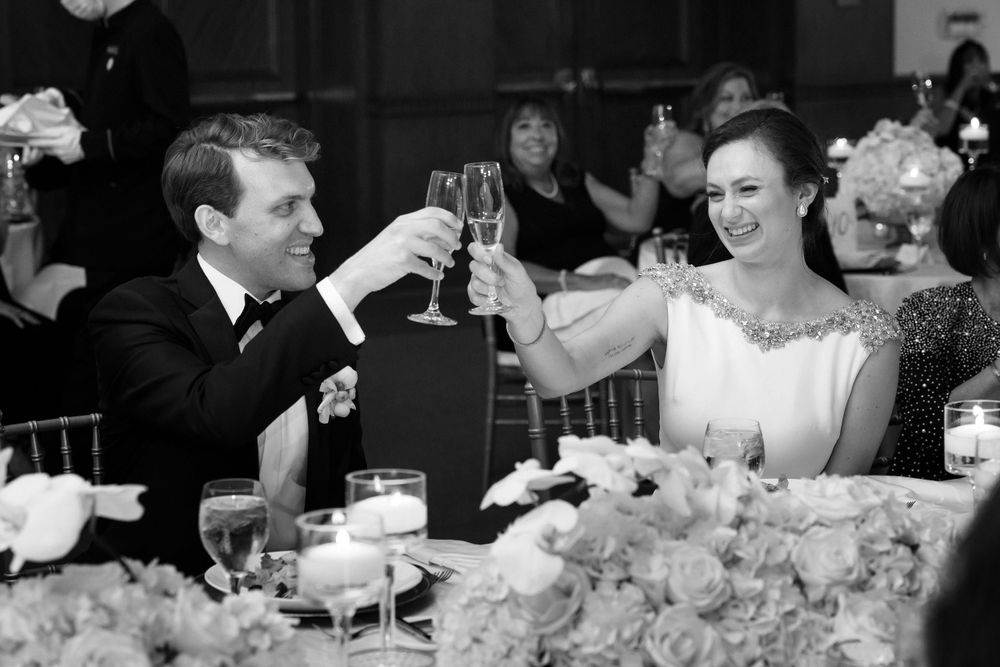 Bride and groom toast during wedding reception at InterContinental Cleveland photographed by Tom Forrest.