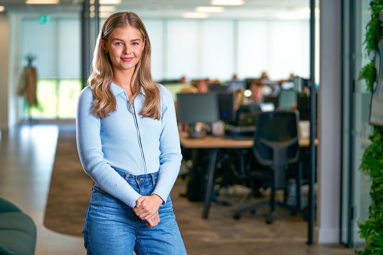 Corporate Headshot - Professional Business Portrait of an employee with blonde hair wearing blue in an office