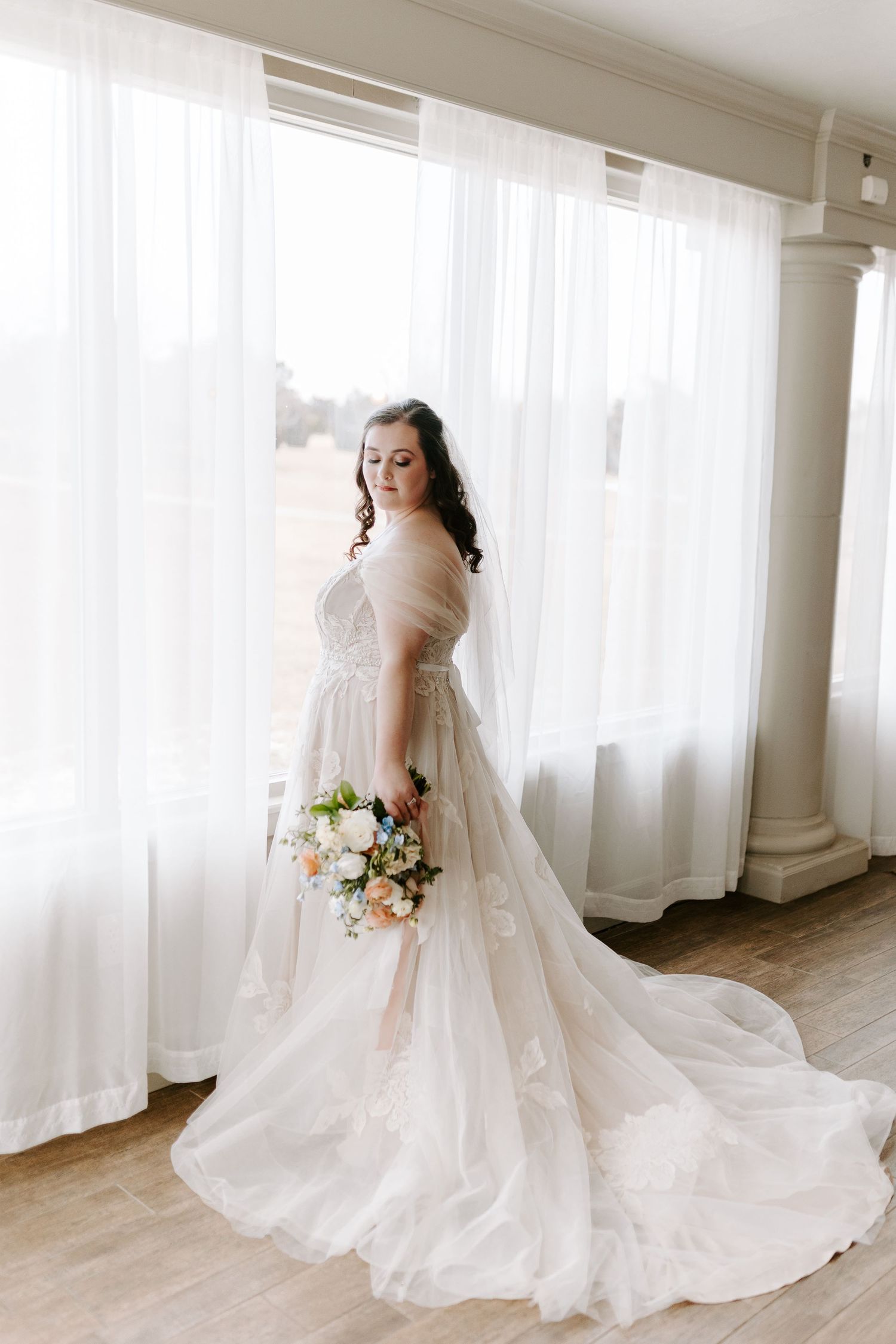 Bride with stunning soft glam makeup by Gaby Makeup Artistry, on a sunny day in Oklahoma City.