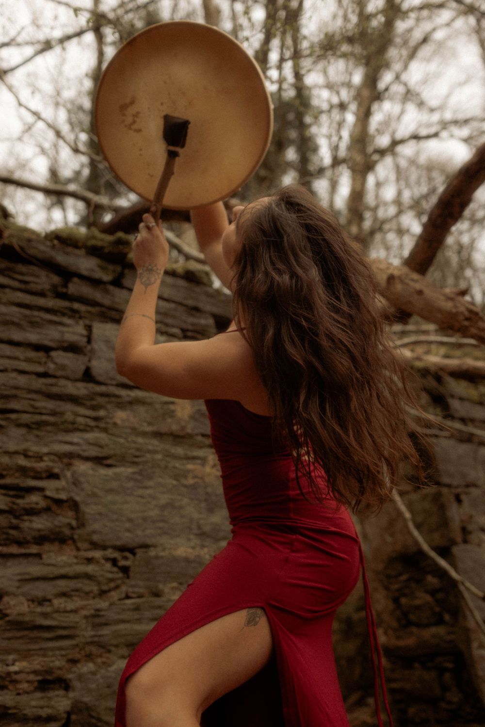 woman banging drum