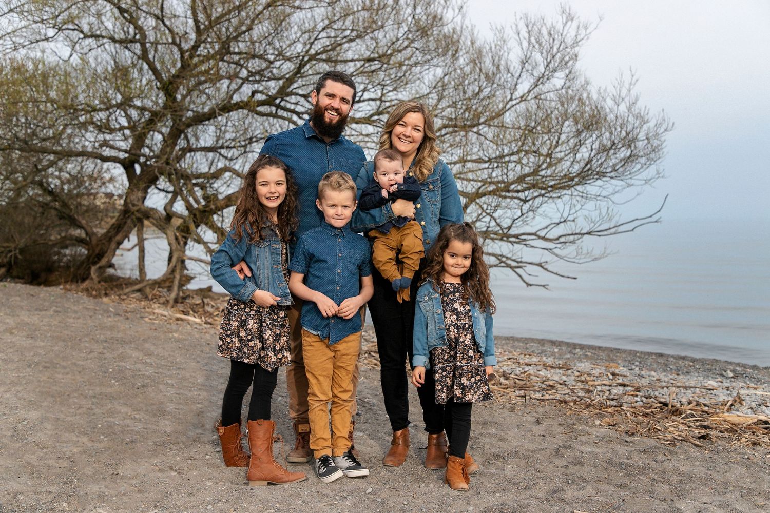 Family of 6 at the beach all in coordinated outfits in Newcastle