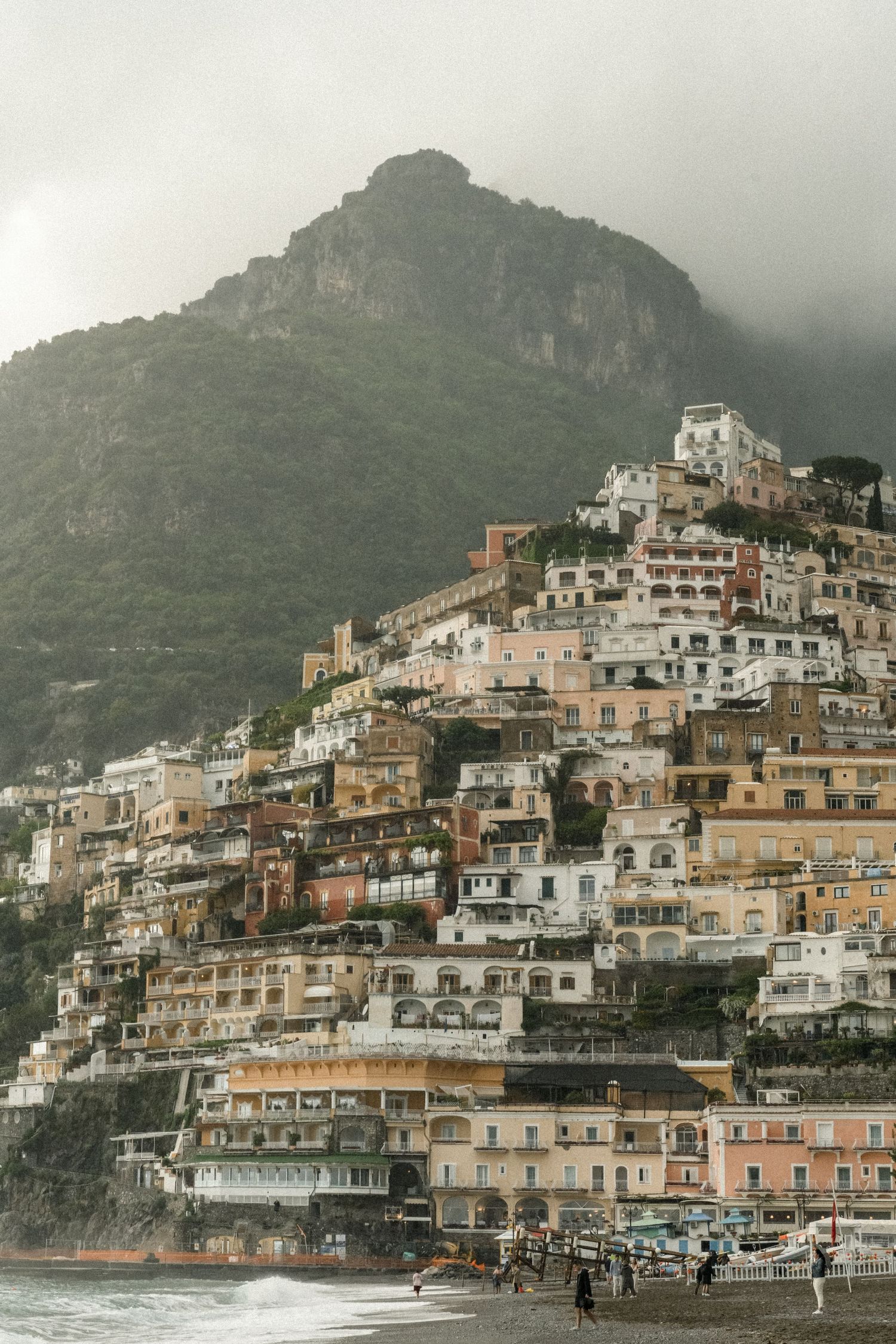 The iconic hillside architecture of Positano cascades down the mountainside toward the Mediterranean Sea.