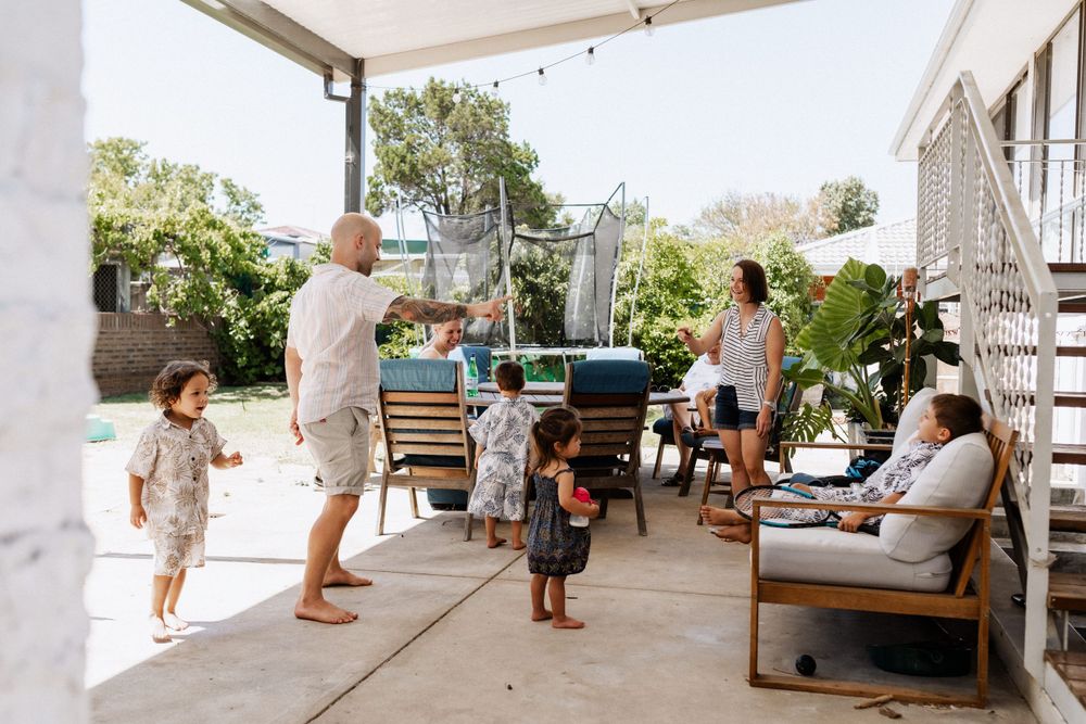 A dance party with uncles, aunties and cousins during an extended family session in Perth