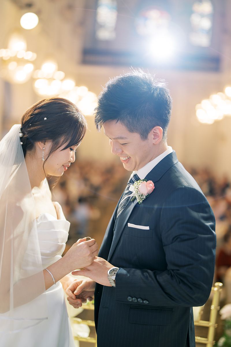 Joyful wedding celebration captured in a warmly lit church setting.