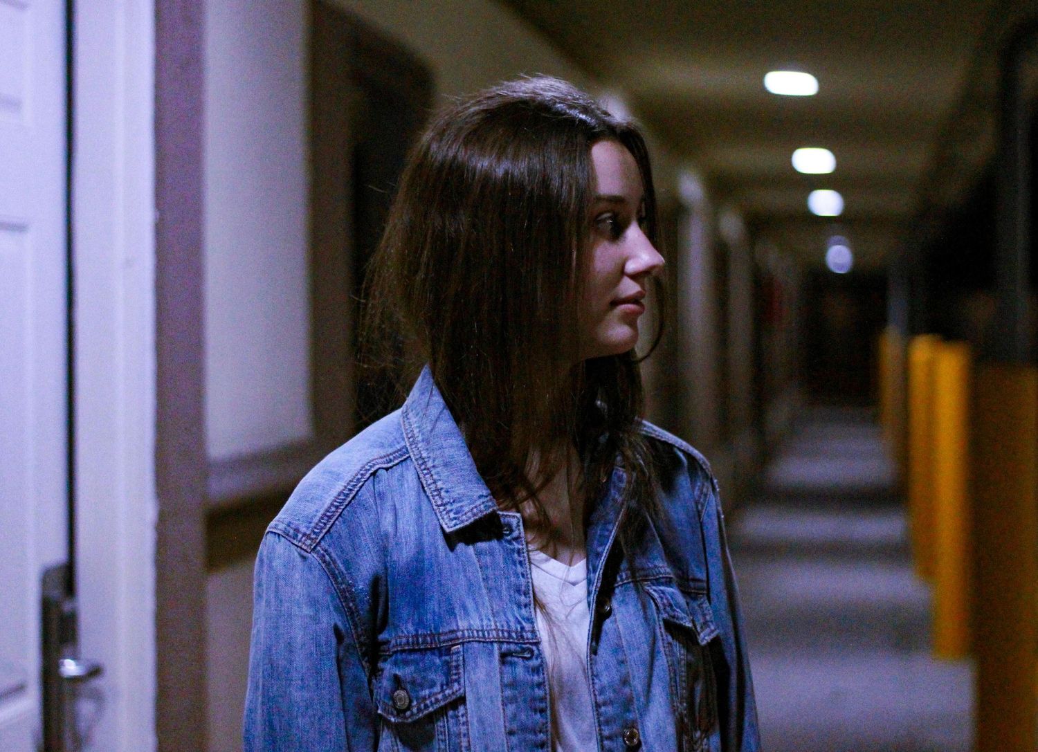 Cinematic vibes, girl looking away from camera at a motel in Texas