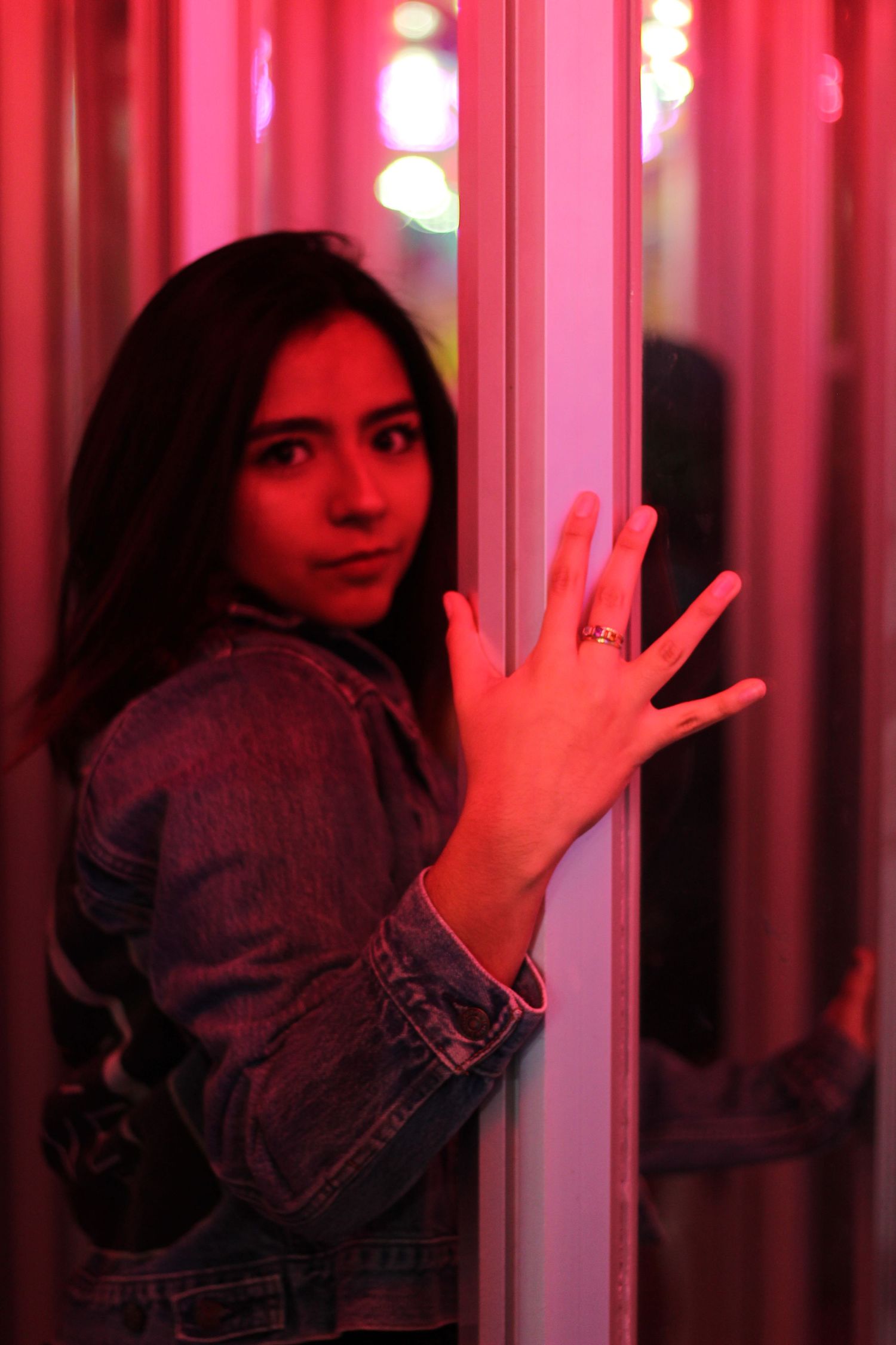 Girl walking into mirror maze