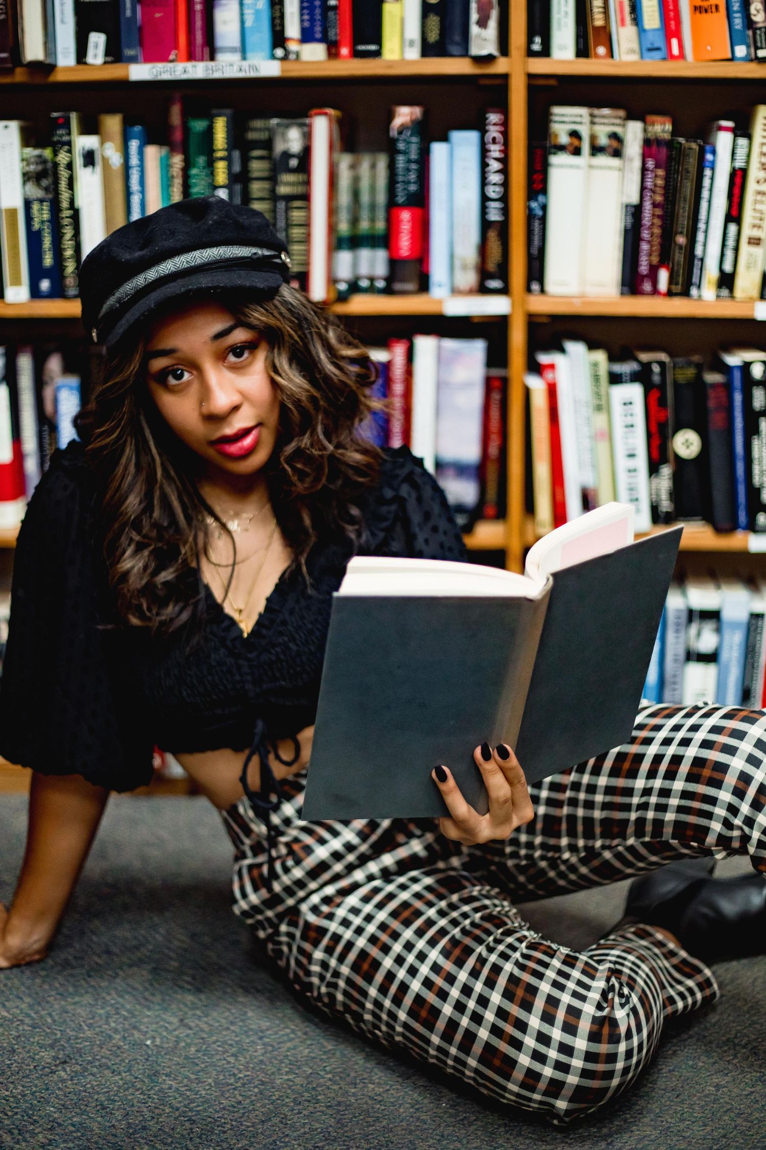 Girl holding book at a bookstore