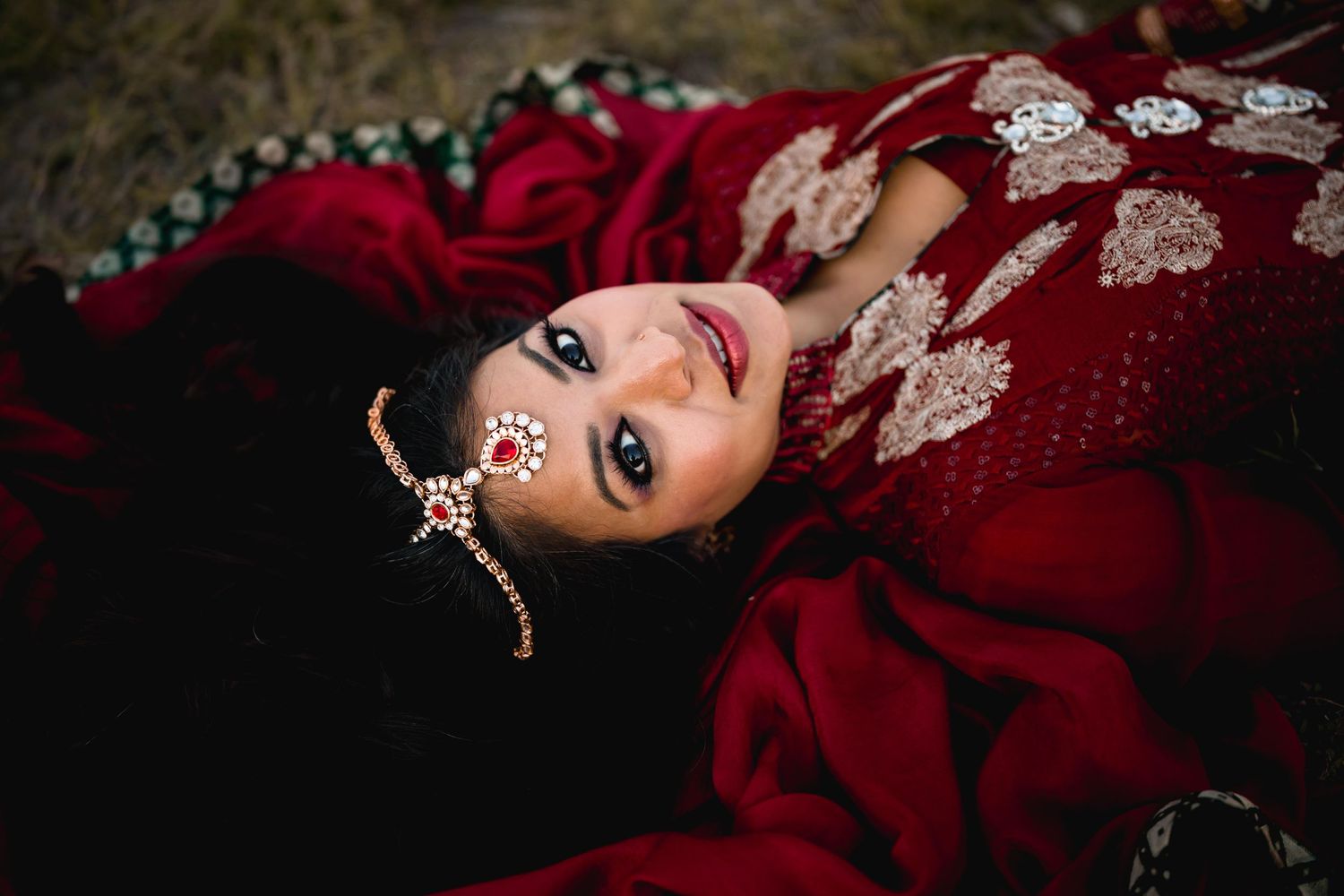 Woman in traditional India dress laying, Bollywood style