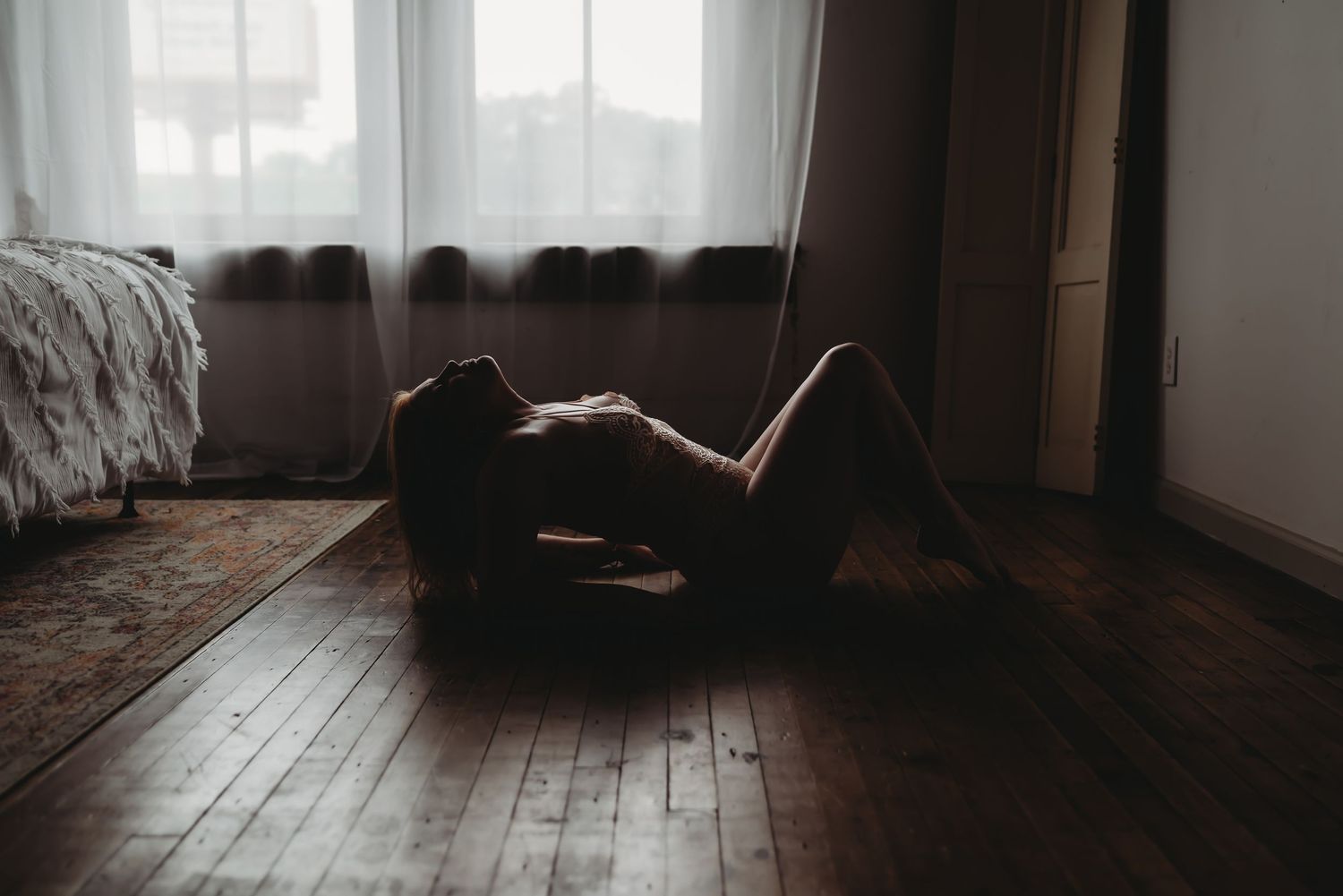 boudoir woman on hardwood floor