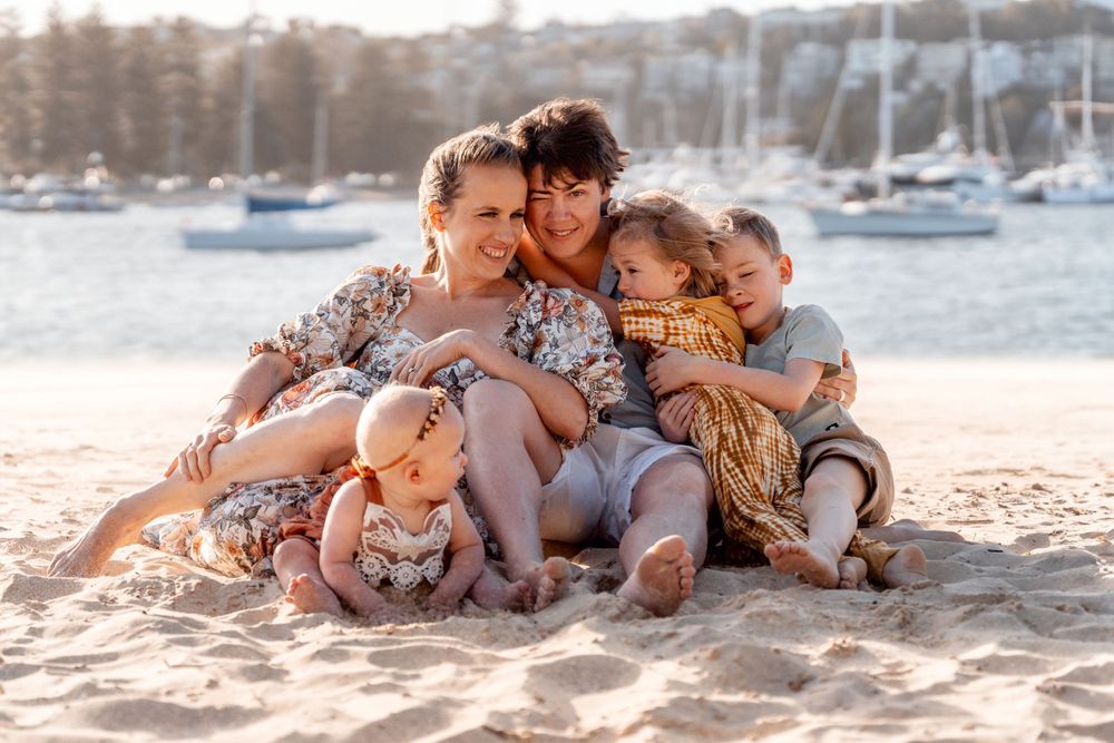 Family snuggles on a family photoshoot northern beaches
