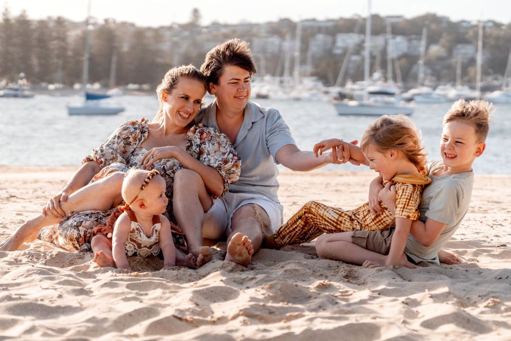 Playful moments during family photoshoot Sydney Clontarf Beach