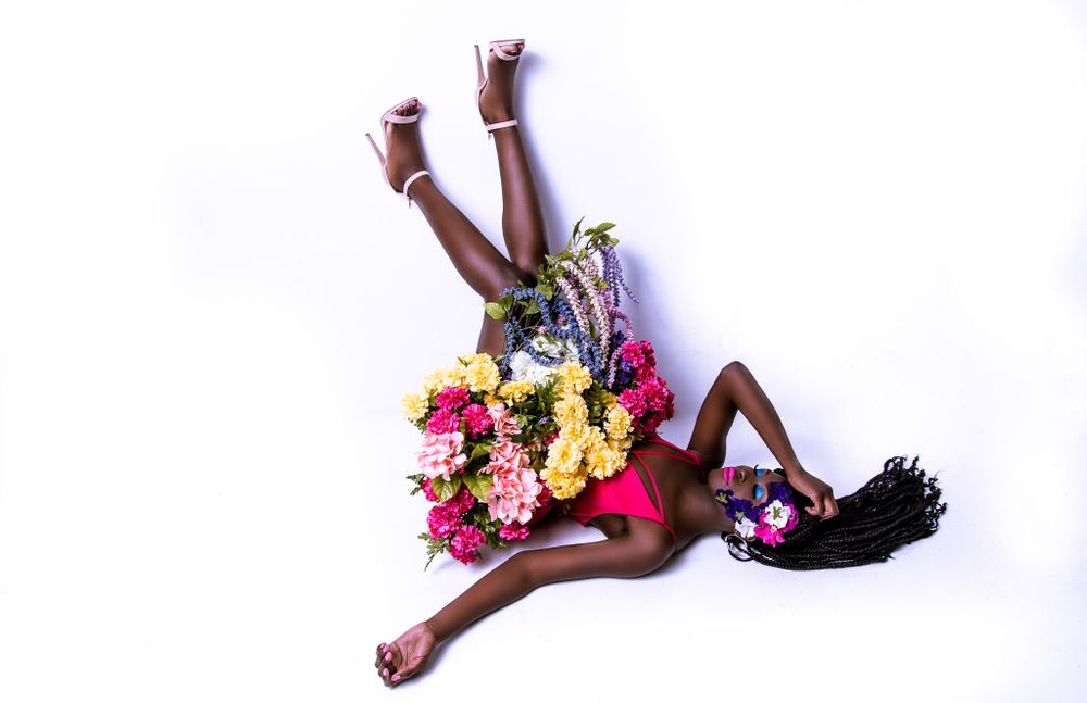 Dynamic dance poses with colorful flowers against white background.