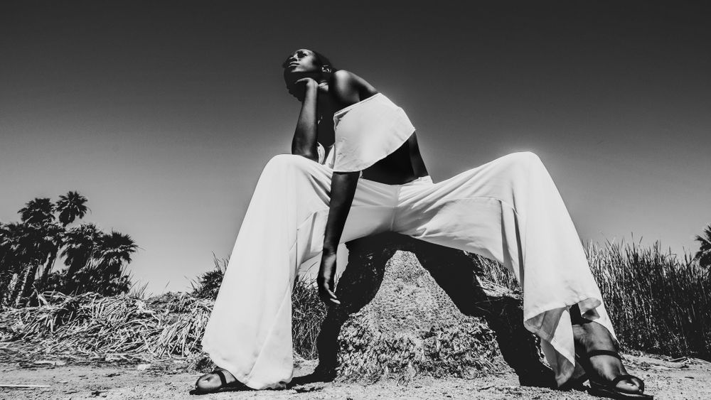 Black and white series of running poses in natural outdoor setting.