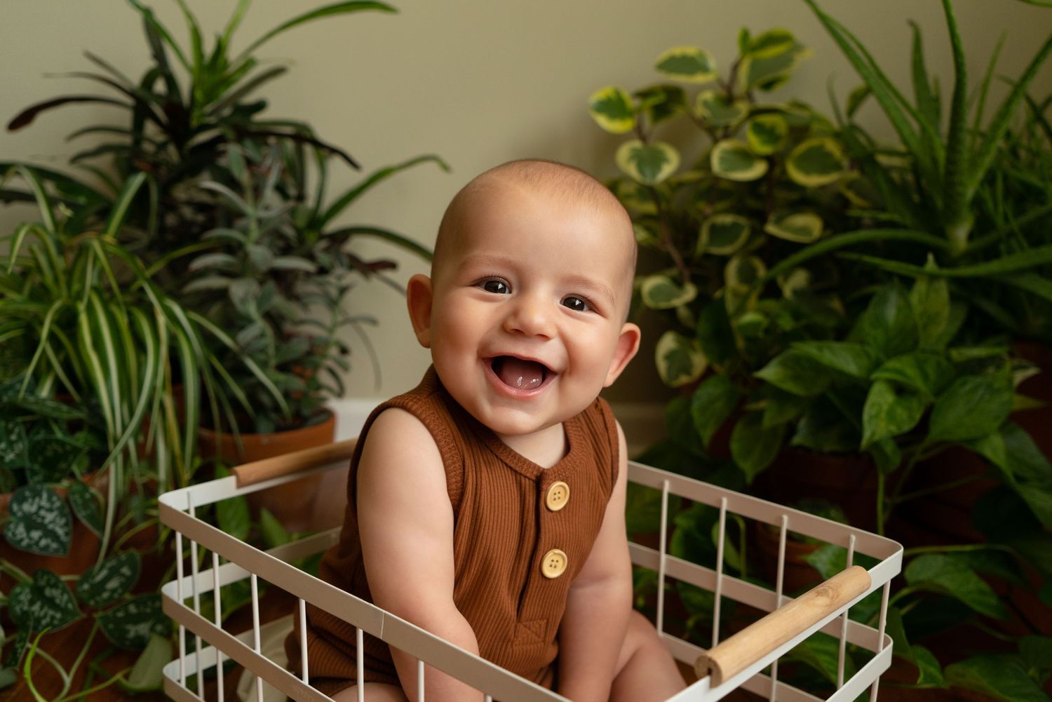 baby smiles from basket