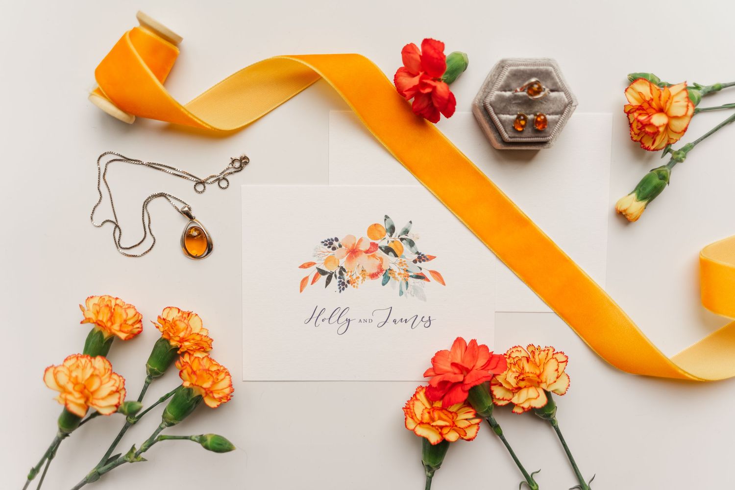 Autumn theme wedding flat lay stationary Amber jewellery