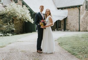 Groom and Bride in front of a beautiful building