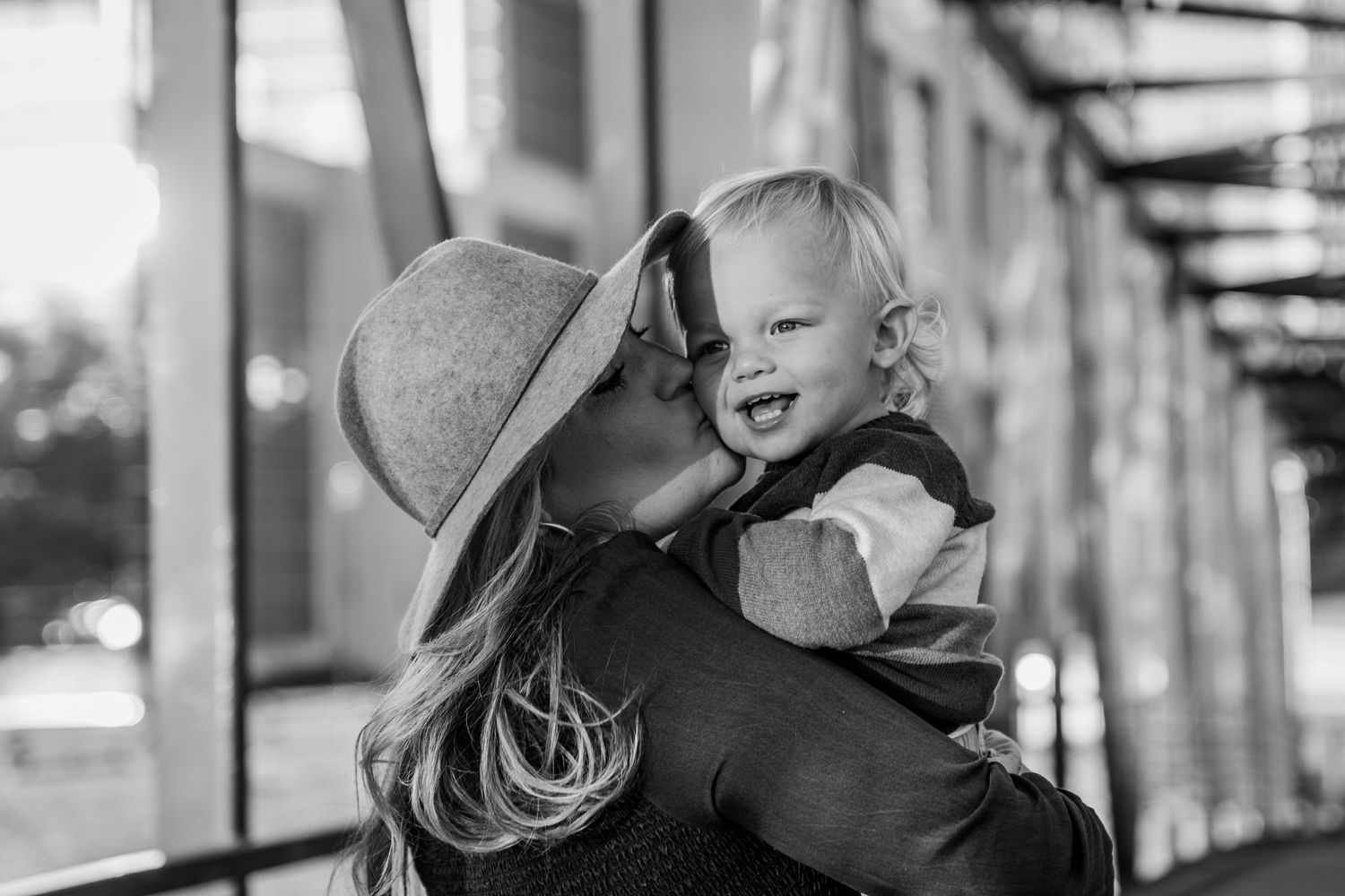 Black and white portraits showing joyful expressions and natural interactions between family members.