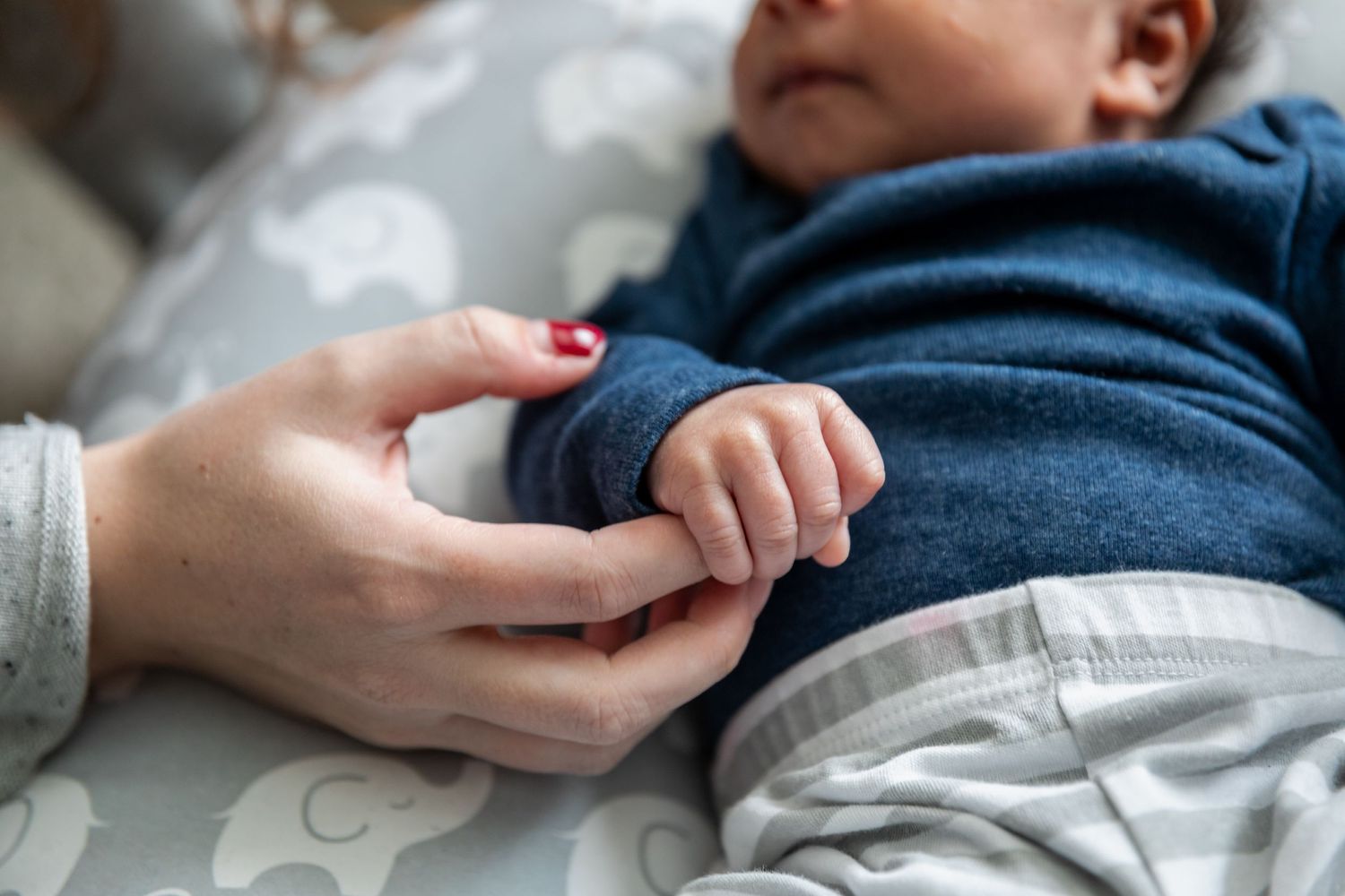 Close-up detail shots of gentle hand holding and tender moments.