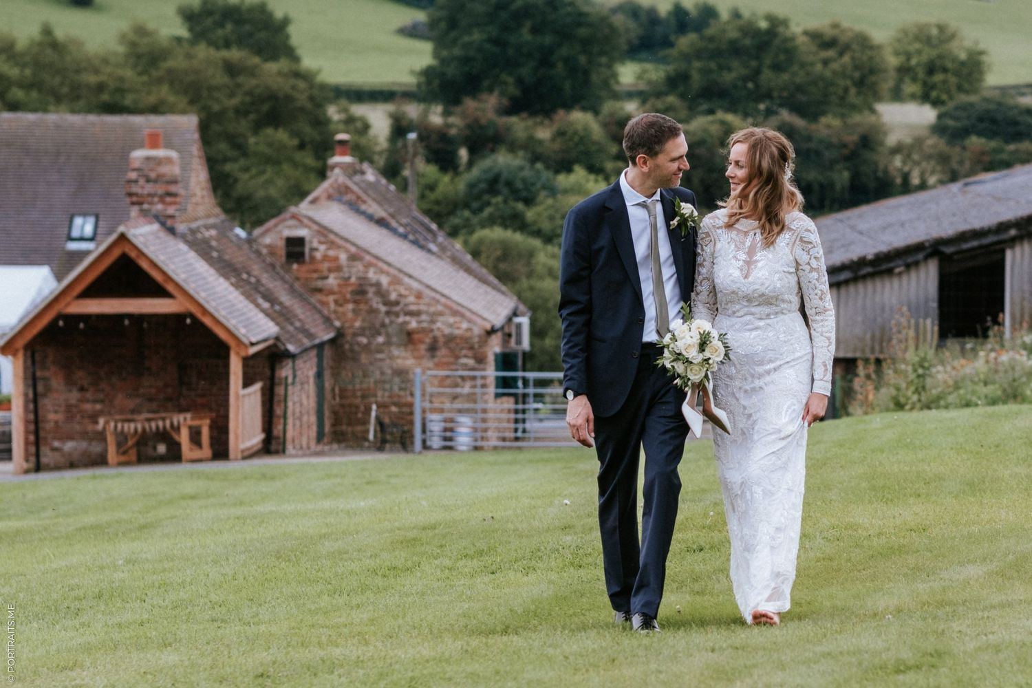 A bride and groom look into each others eyes at Beauvale Abbey.