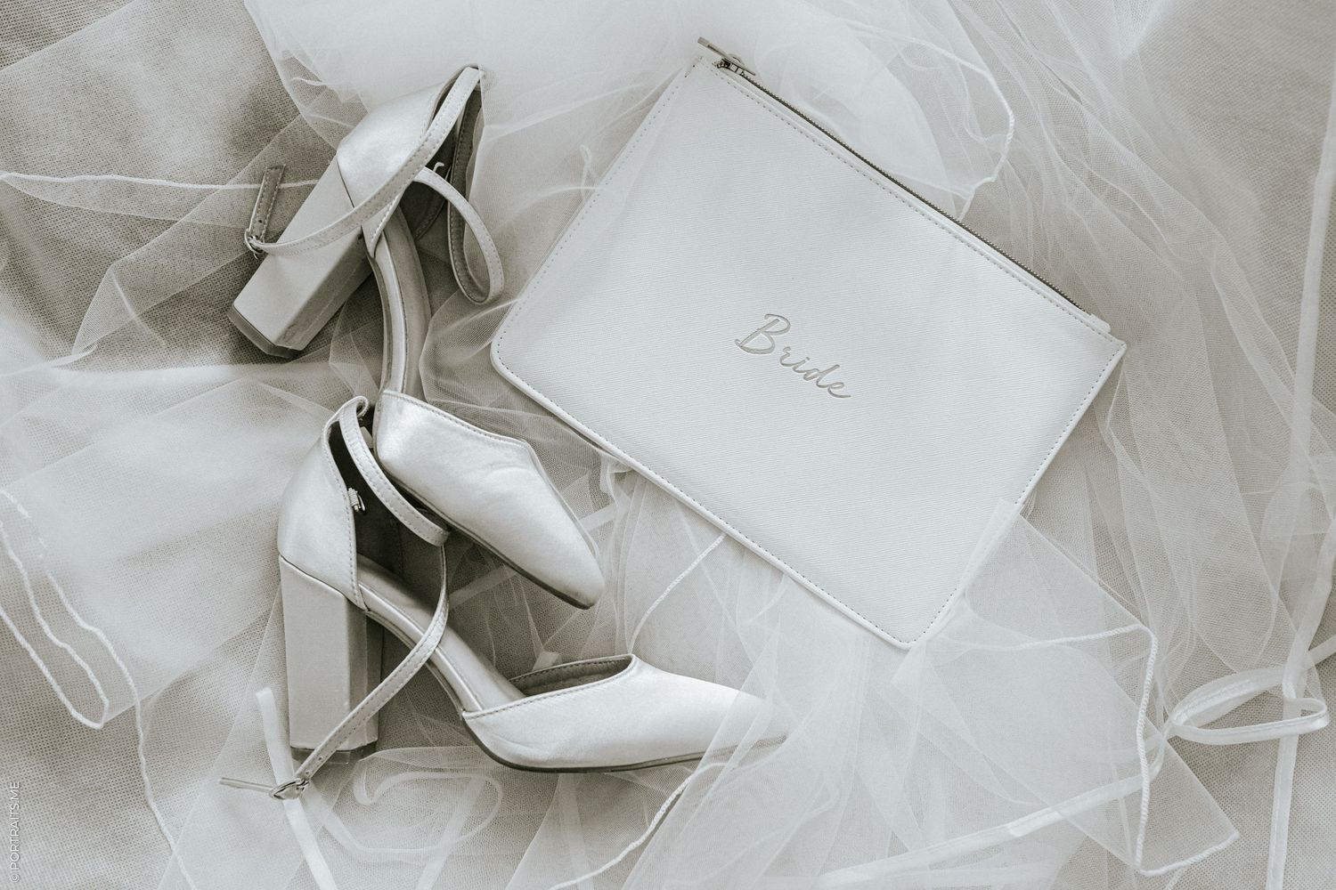 A bride's wedding shoes and veil in a box.