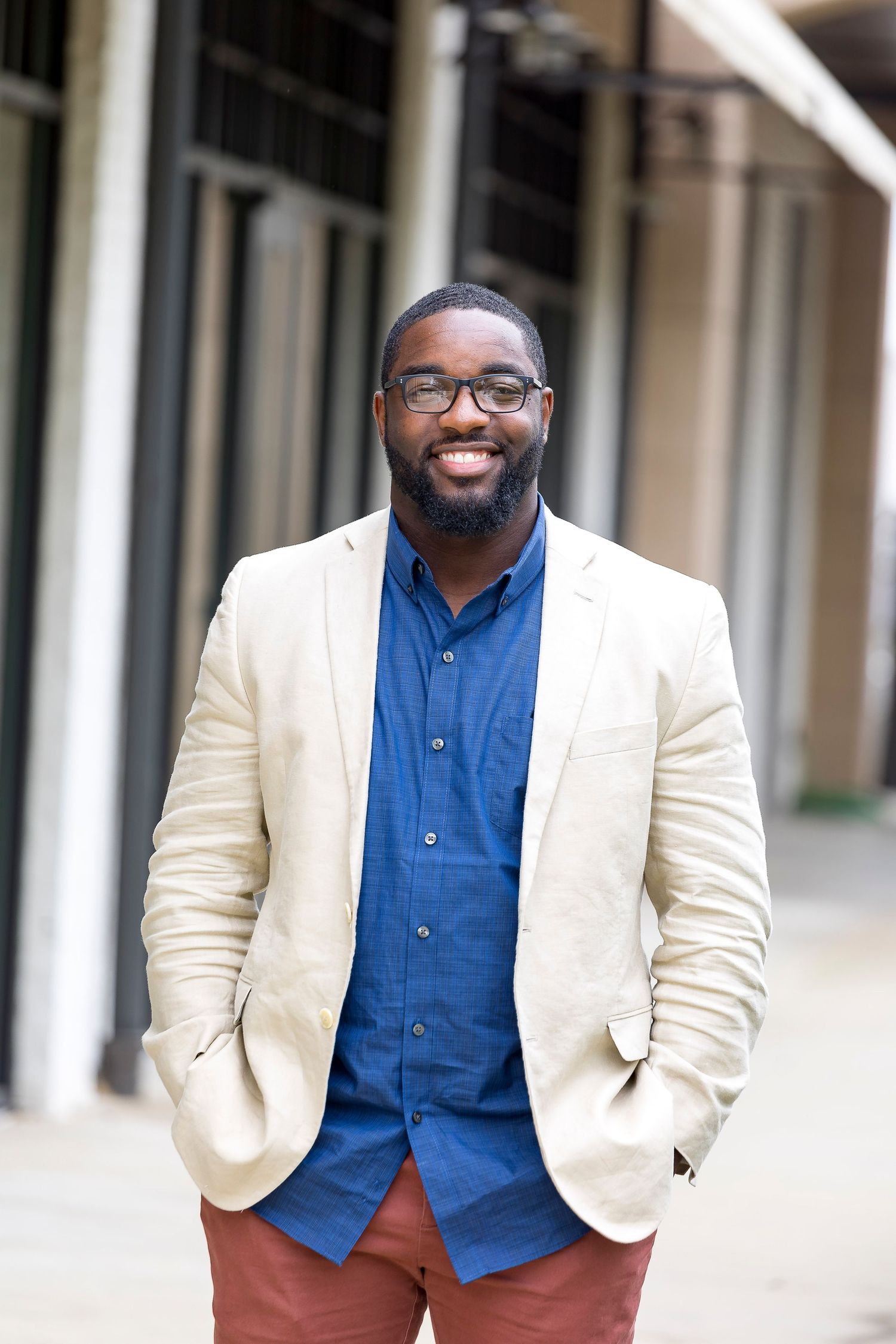 professional headshot of man in alleyway by Carter Photography & Design
