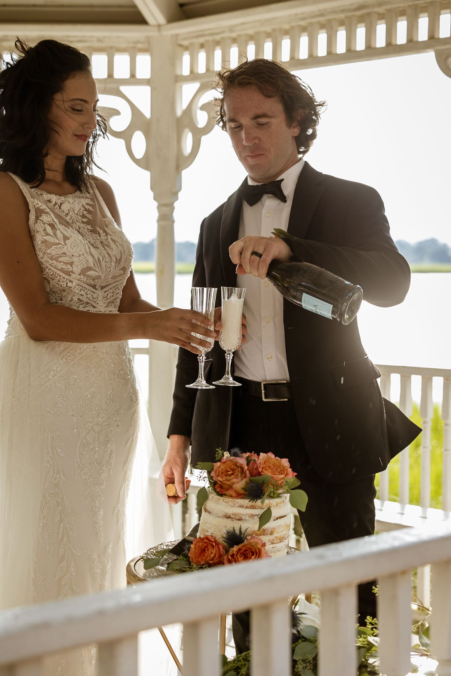 The bride and grooms first champagne toast under the gazebo marsh side in the Landings, Skidaway Island, Ga.