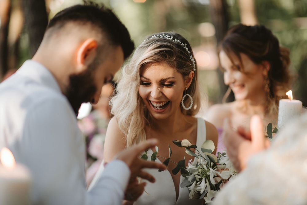 Intimate wedding ceremony moment captured in natural outdoor lighting.