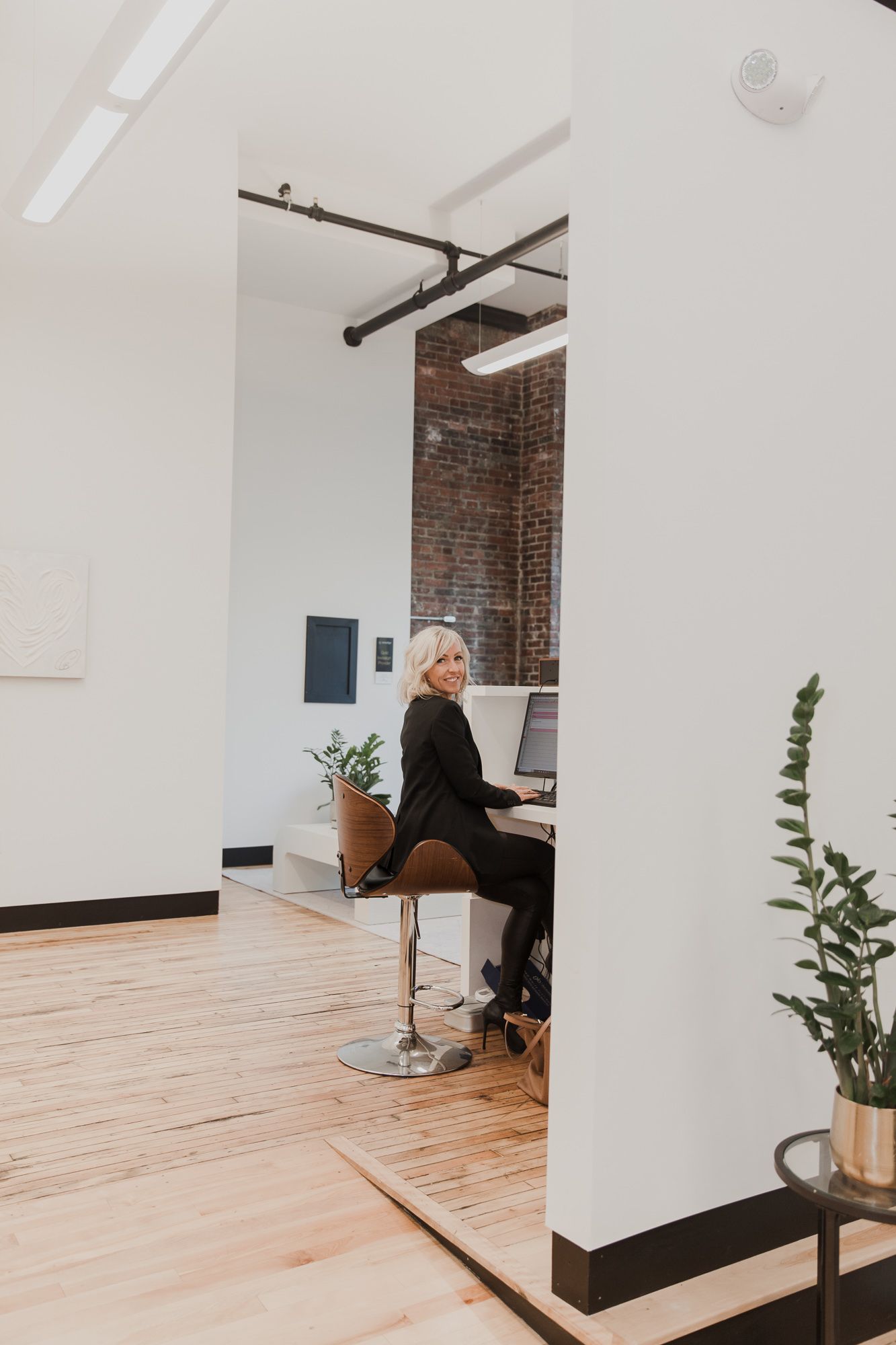A confident female entrepreneur shares insights about social media strategies during a local business networking event.