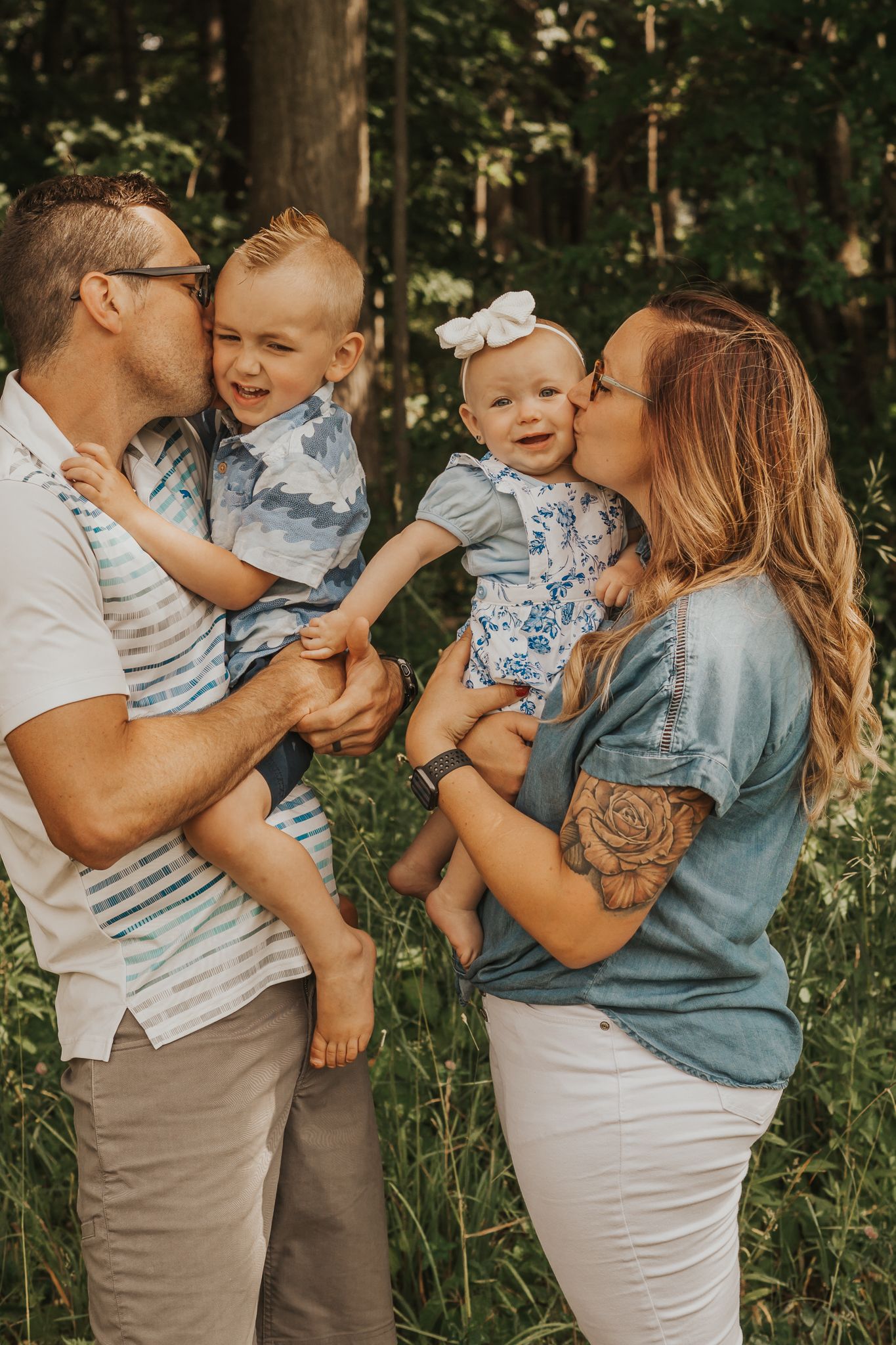 Intimate family moments captured in a lush green outdoor setting.