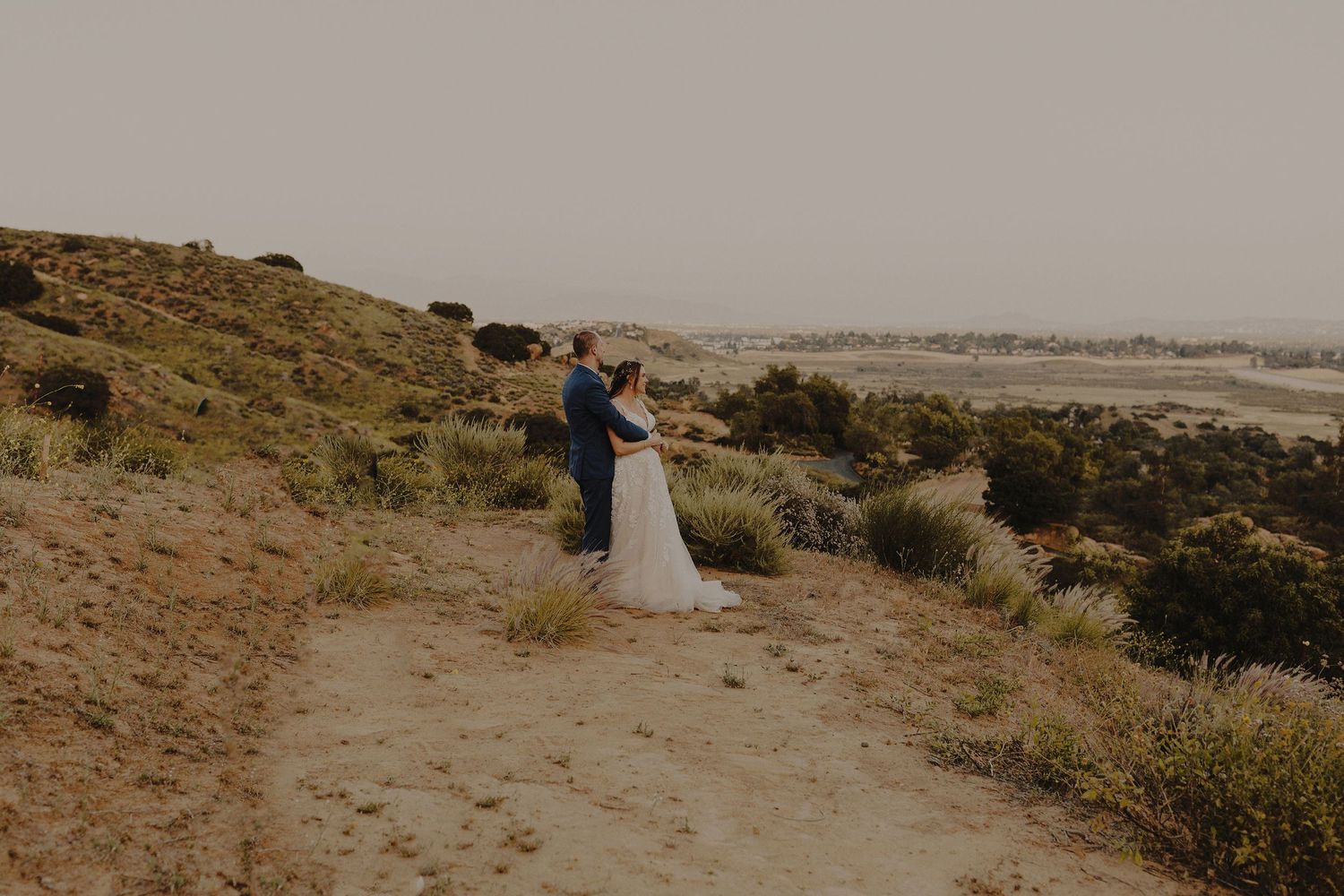 E Noelle Photography backyard wedding in Hidden Hills Los Angeles, bride and groom portraits looking at sunset