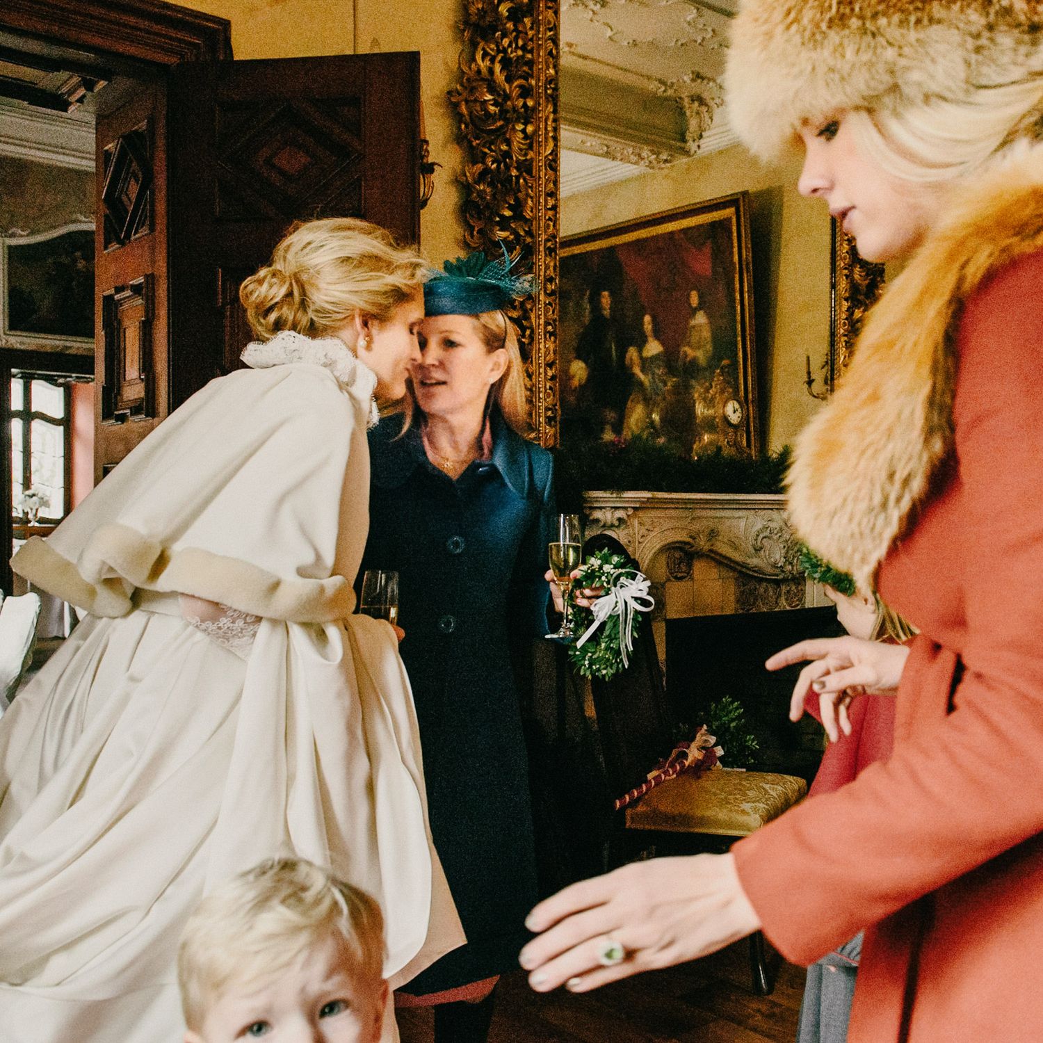 Candid moment at a festive gathering with people in vintage-style clothing.