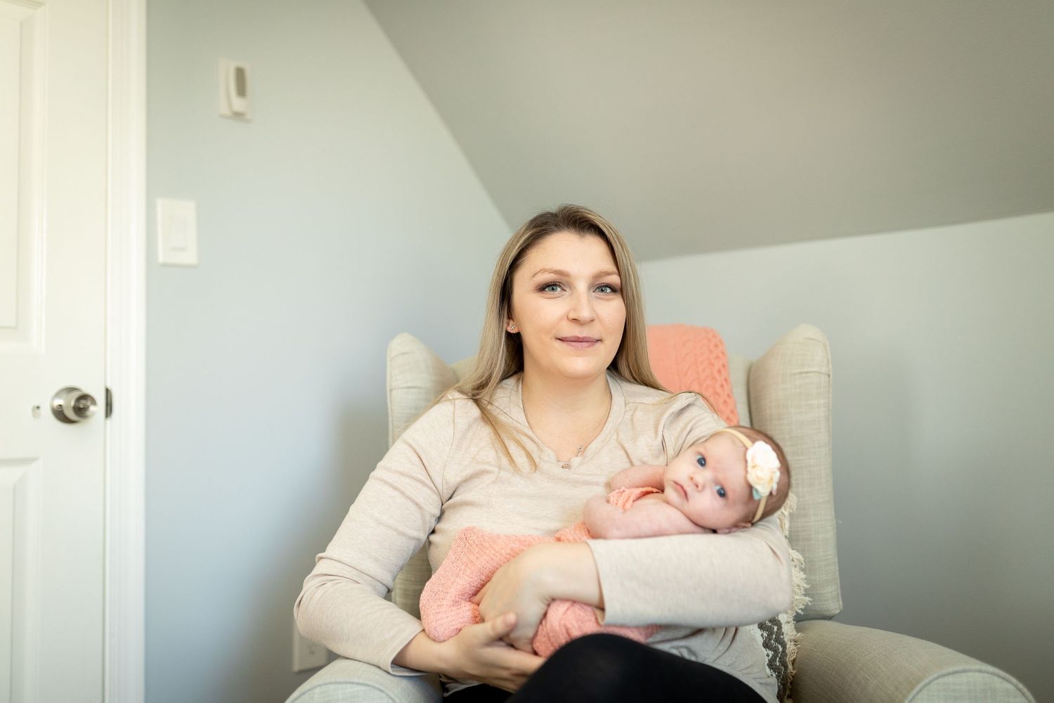 Peaceful bonding scene with infant in bright nursery setting.