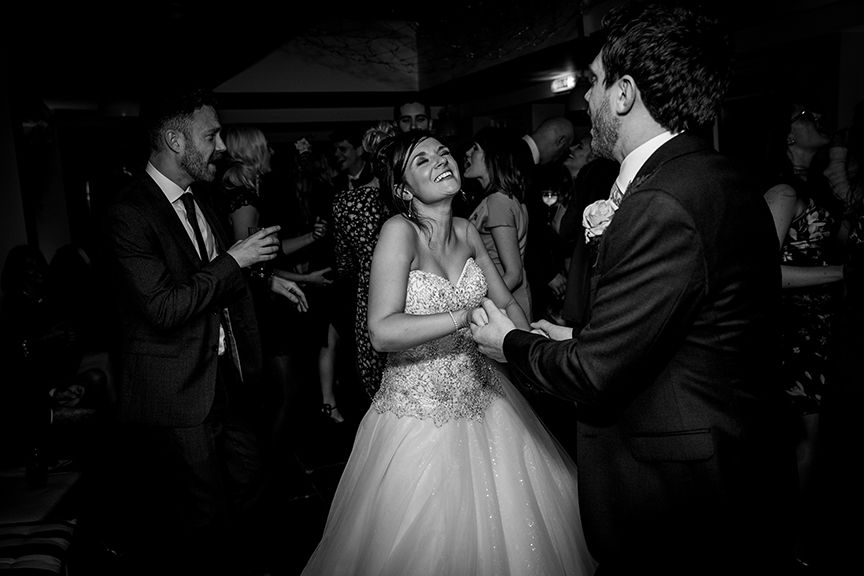 Bride & Groom laughing whilst doing their first dance