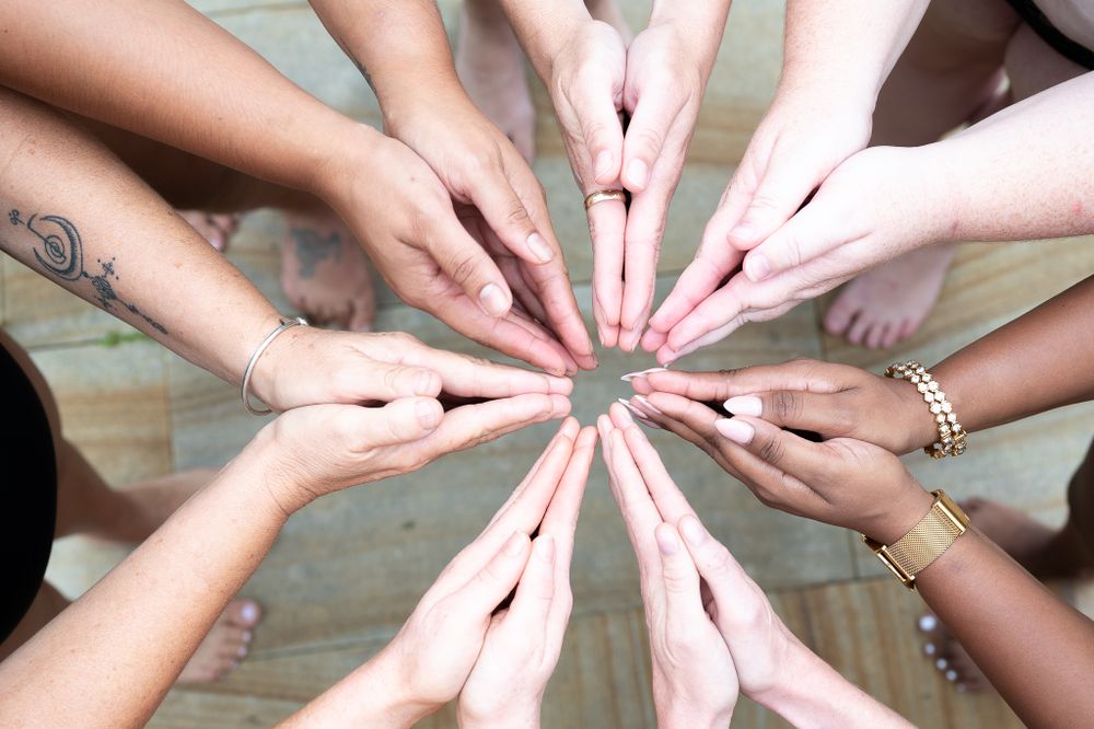 We are all the same - many hands together in one photo